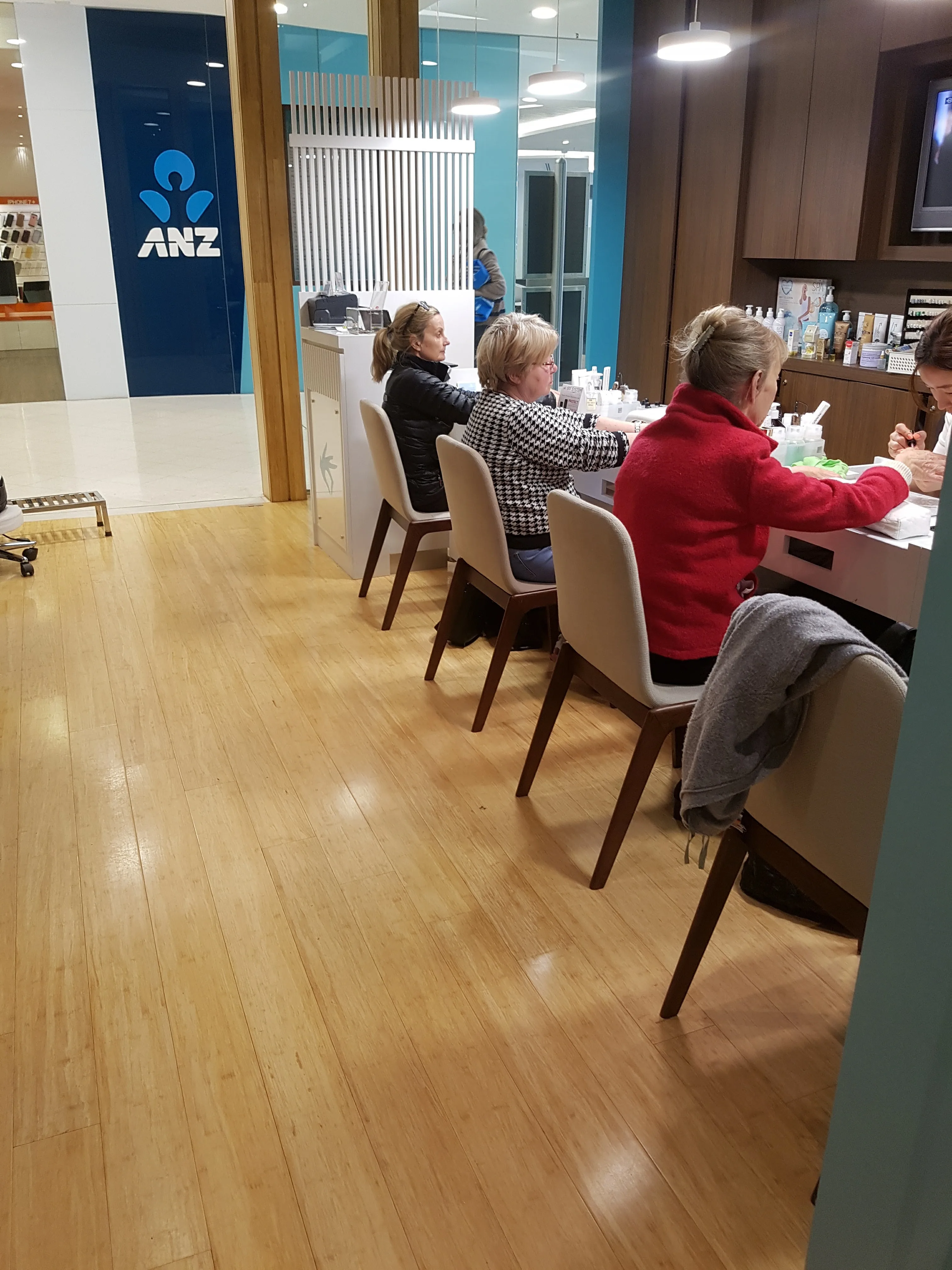 Clients seated at the manicure tables inside Organique Beauty, 353 Chapel St, South Yarra