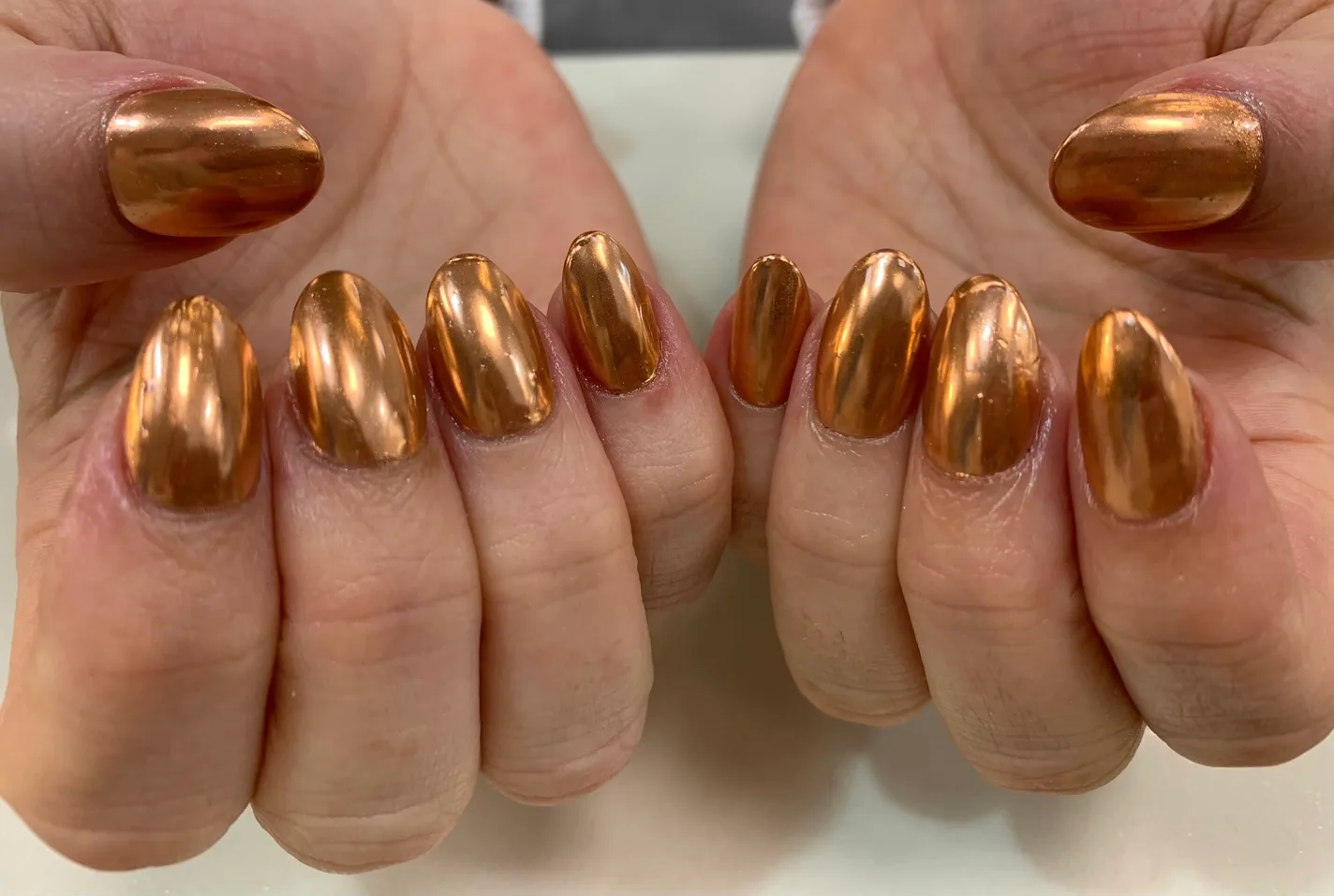 Mirror copper-chrome almond nails by Organique Beauty