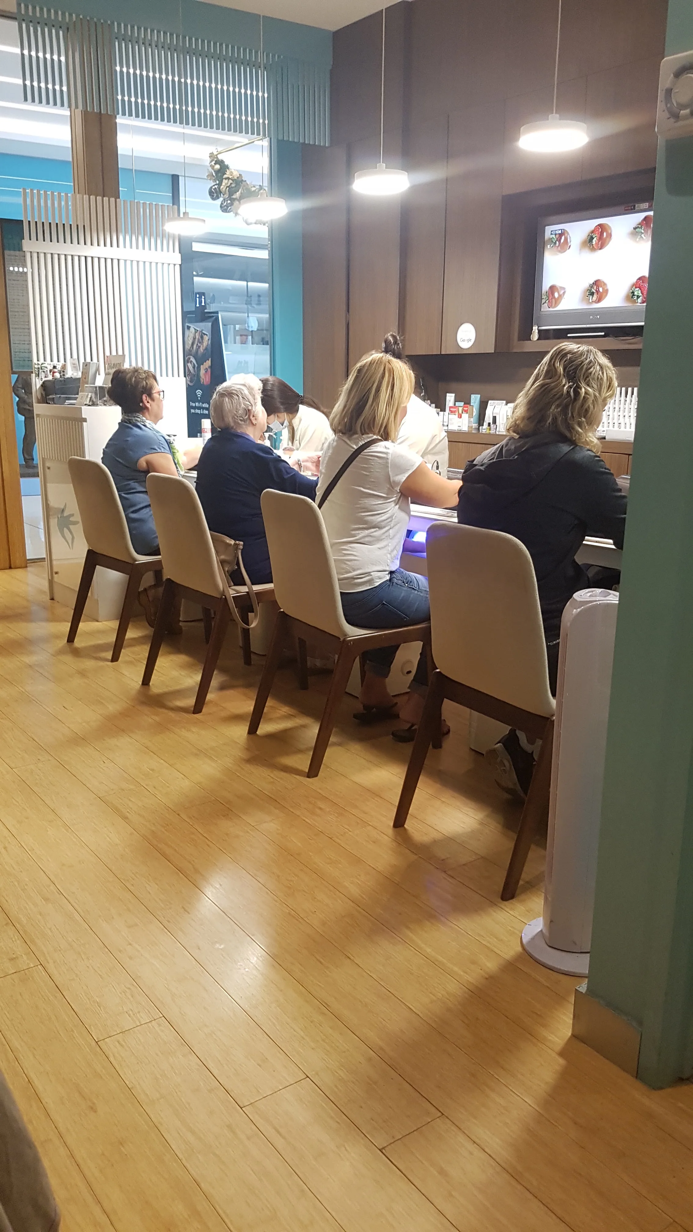Clients being pampered at the Organique Beauty nail bar — Chapel St South Yarra