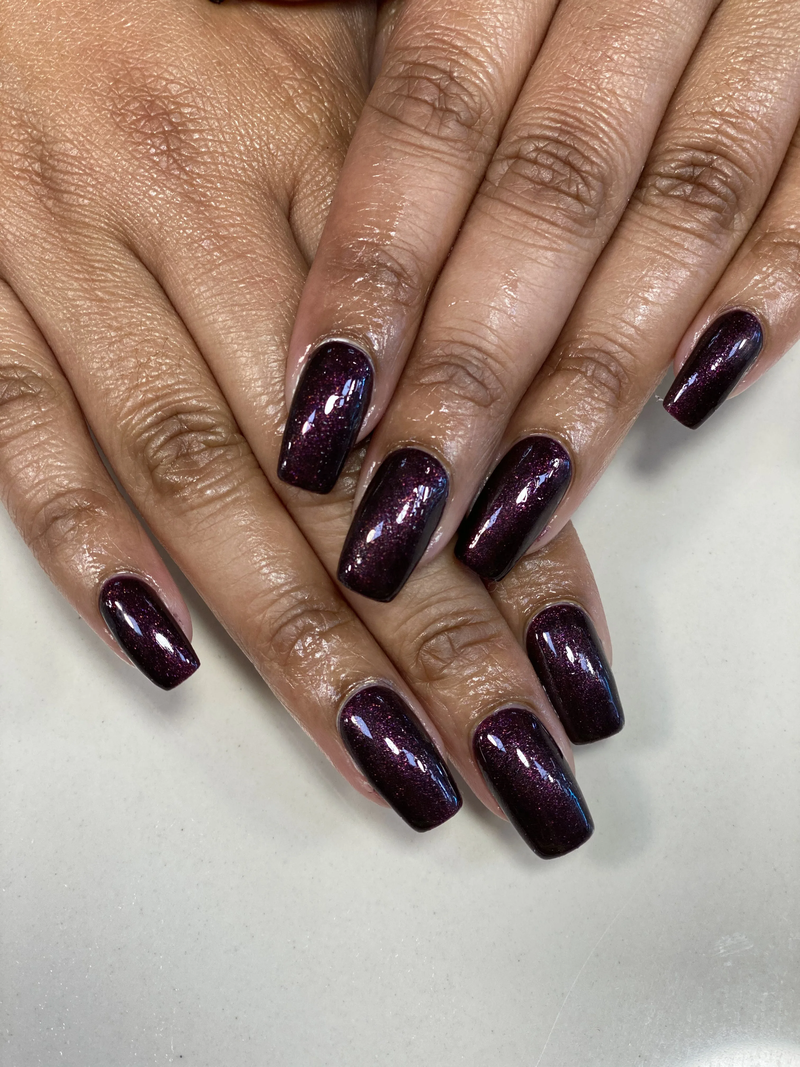 Deep aubergine and plum cat-eye shimmer nails, long square